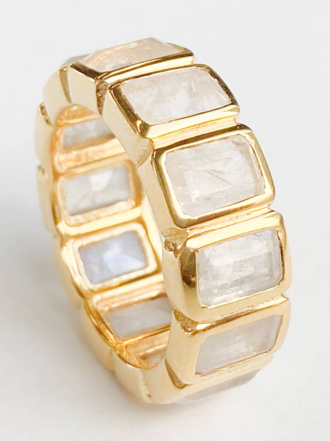 R115 Wide Eternity band with emerald cut stones for wholesale by Treisi