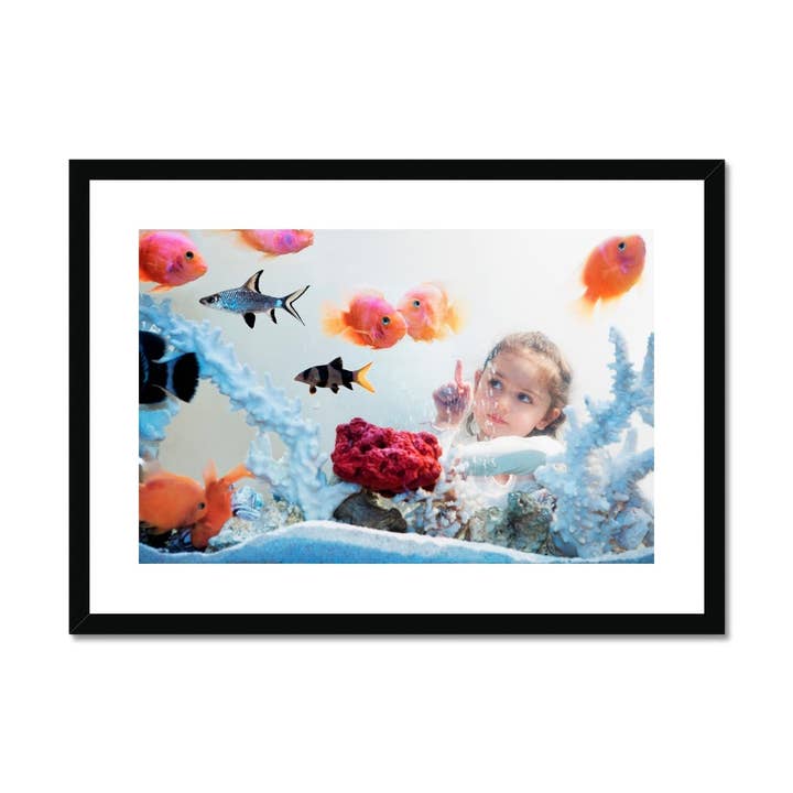 Tableau encadré et monté Girl watching tropical fish pour la vente par Sorbey