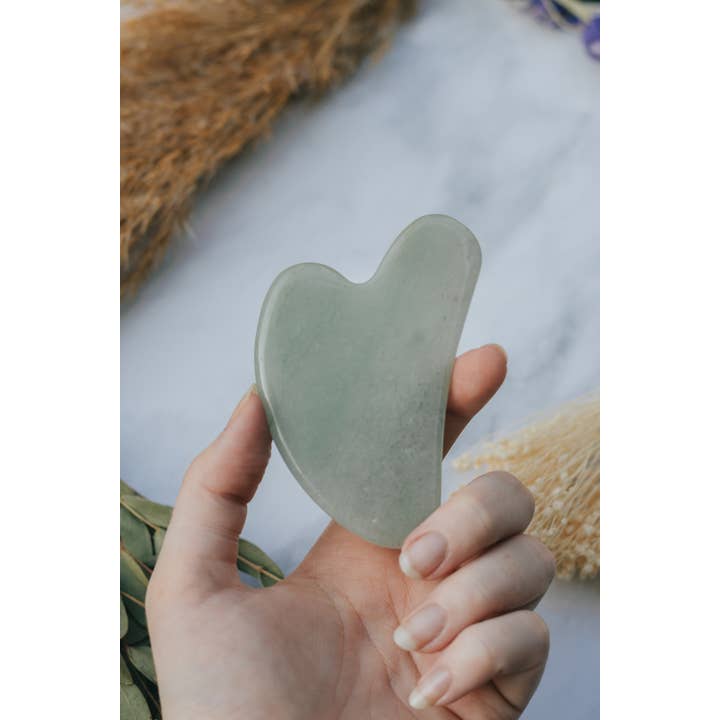Xander Kostroma - Wholesale Gua Sha Tool - Jade Crystal Gua Sha with Black Skull Pouch