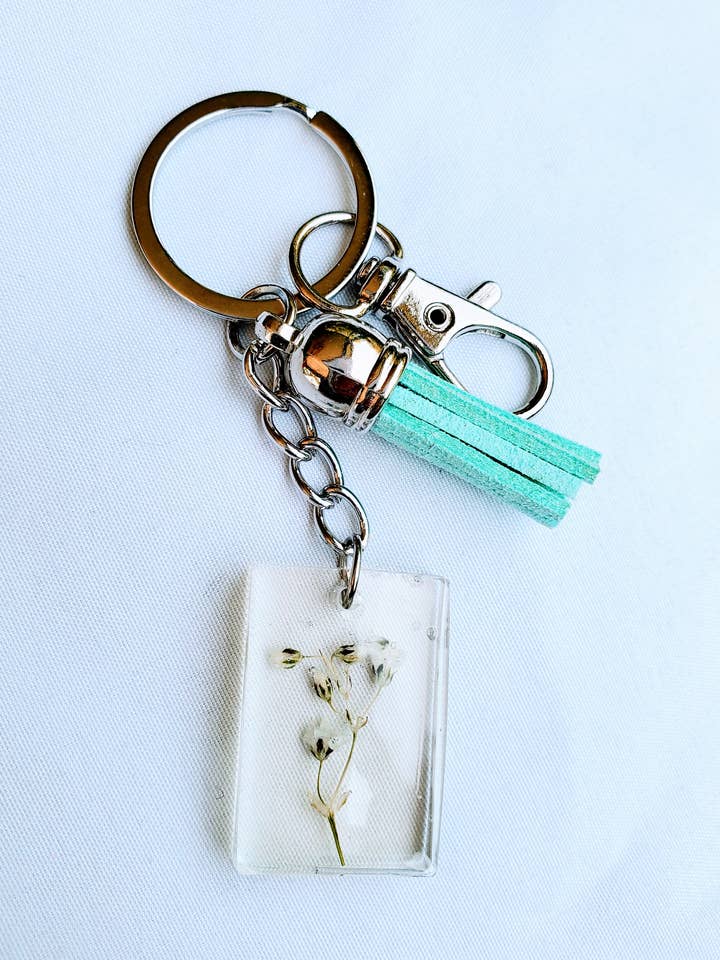 Baby's Breath Resin Keychain with Silver Ring for wholesale by Survivors Alliance for Growth and Employment