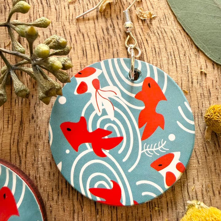 Wood Disc Drop Earrings – Sea Blue Abstract Fish Pattern for wholesale by Pin Up Cosmetics
