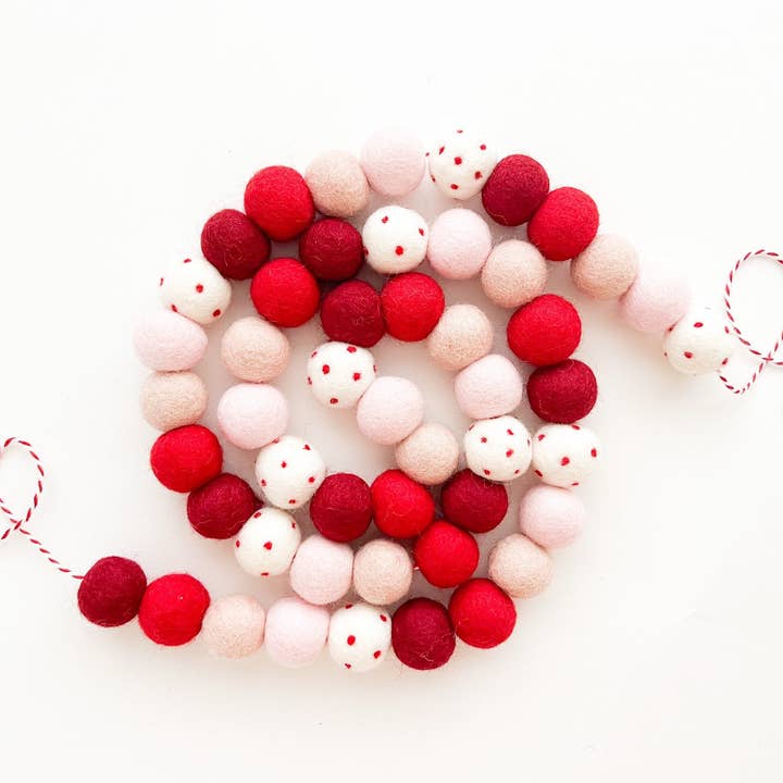 Sprinkle of Red & Pink Felt Ball Garland for wholesale by Pearl & Jane