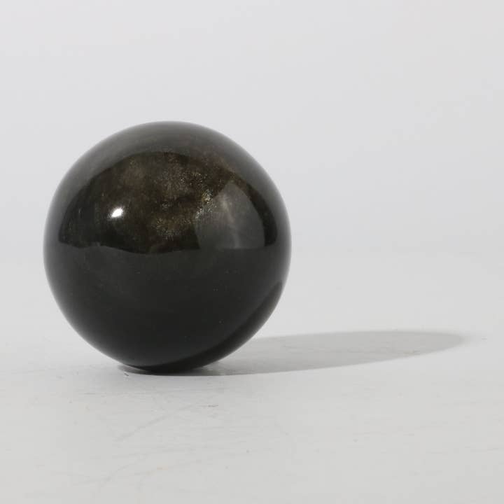 Sphère en obsidienne dorée pour la vente par Stonebridge Imports