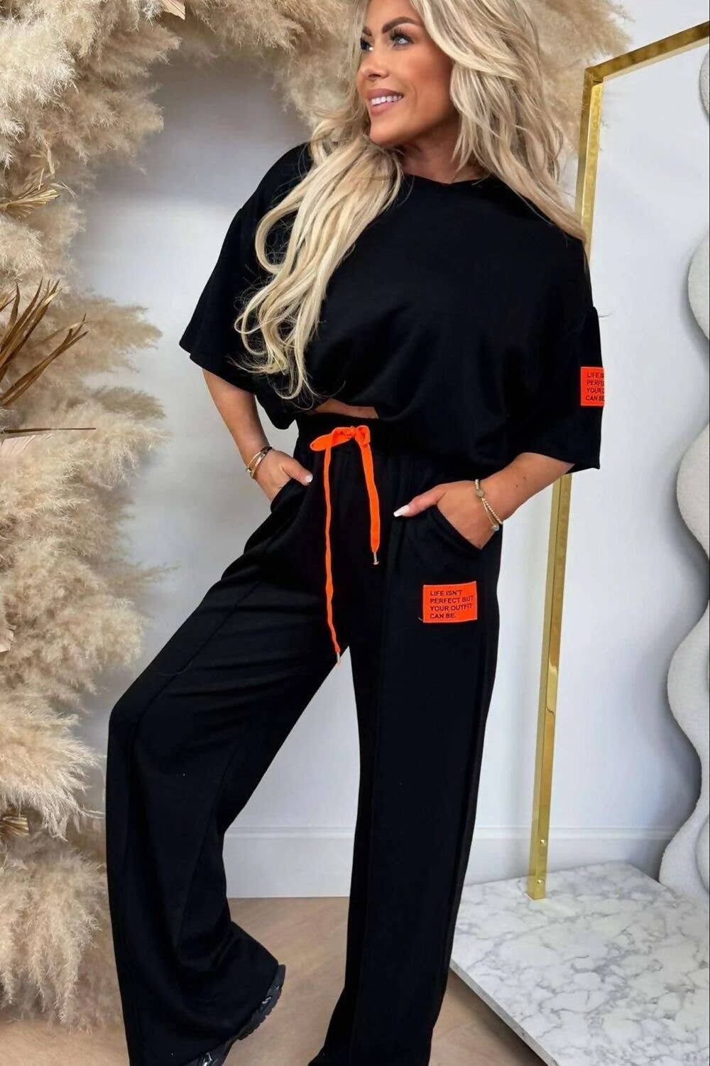 J5FASHION - Wholesale Lounge Set - Women's - GRAPHIC BADGE BAGGY T-SHIRT WITH WIDE LEG TROUSER1