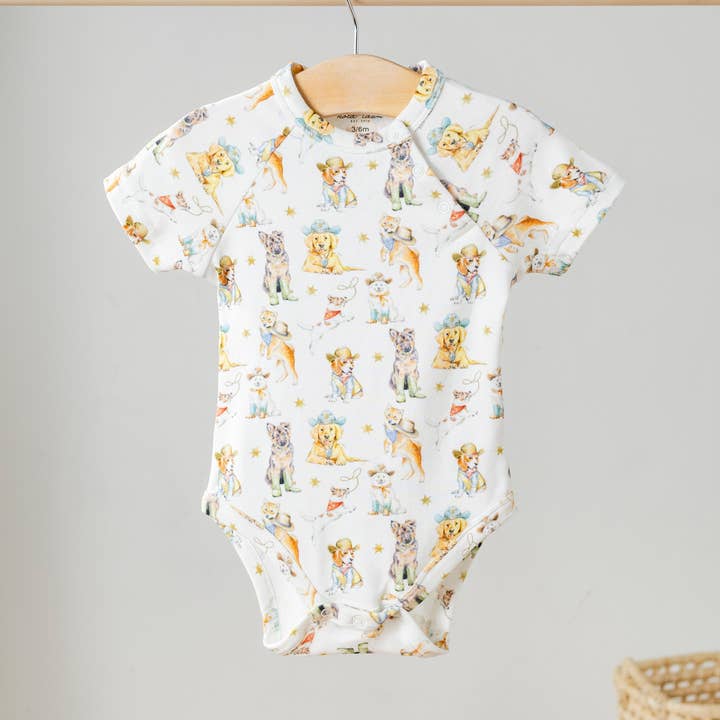 Cowboy Pups Organic Cotton Onesie for wholesale by Nola Tawk