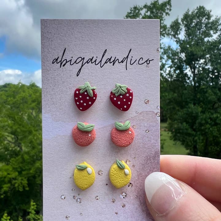 Fruit Stud Pack of 3 Earrings: Strawberries, Lemons, Peaches for wholesale by abigailandi.co