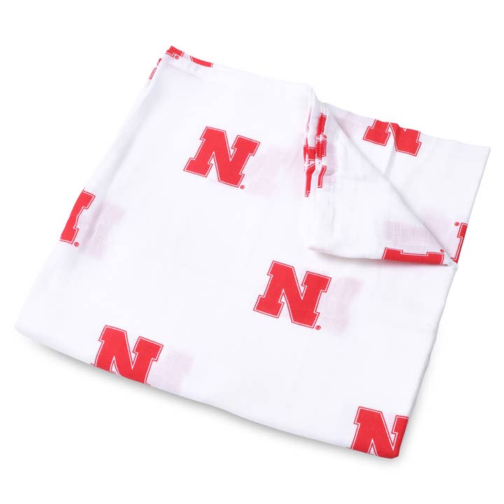 University of Nebraska Muslin Swaddle Blanket for wholesale by Three Little Anchors