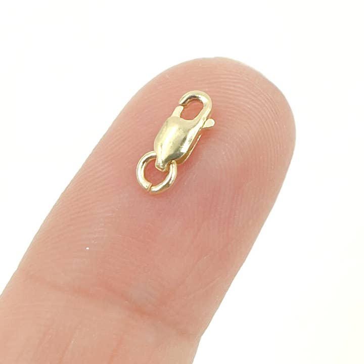 0014LC00WR14KY. 14K Solid Gold Lobster Clasp 7mm. for wholesale by Jewels & Chains