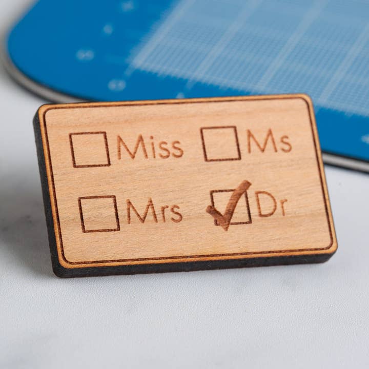 Miss/Ms/Mrs/Dr pin badge for wholesale by Cepheid Studio