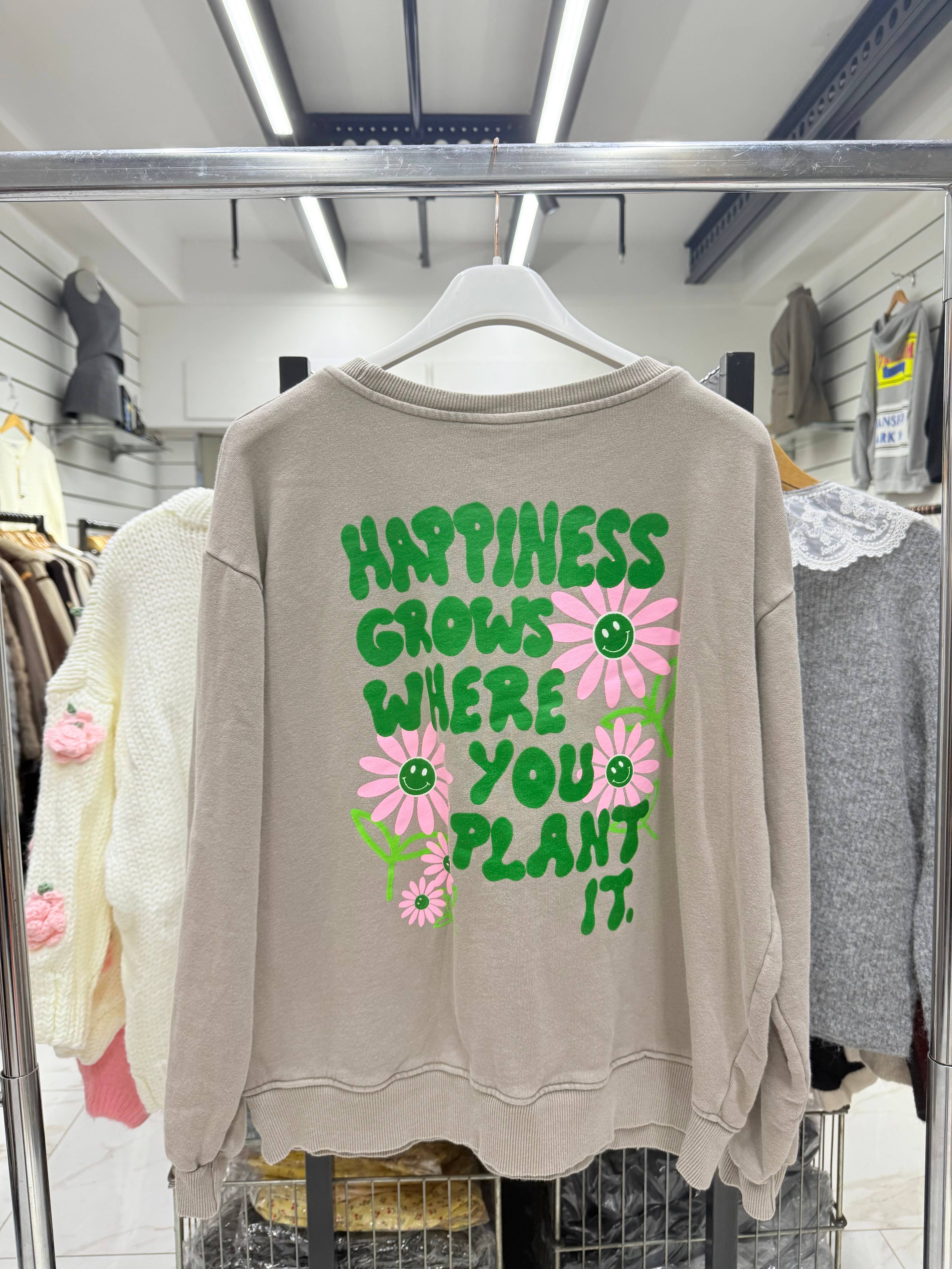 pardo Sweatshirt com decote redondo e lavagem desbotada com estampado de margaridas para venda a revendedores na Faire1