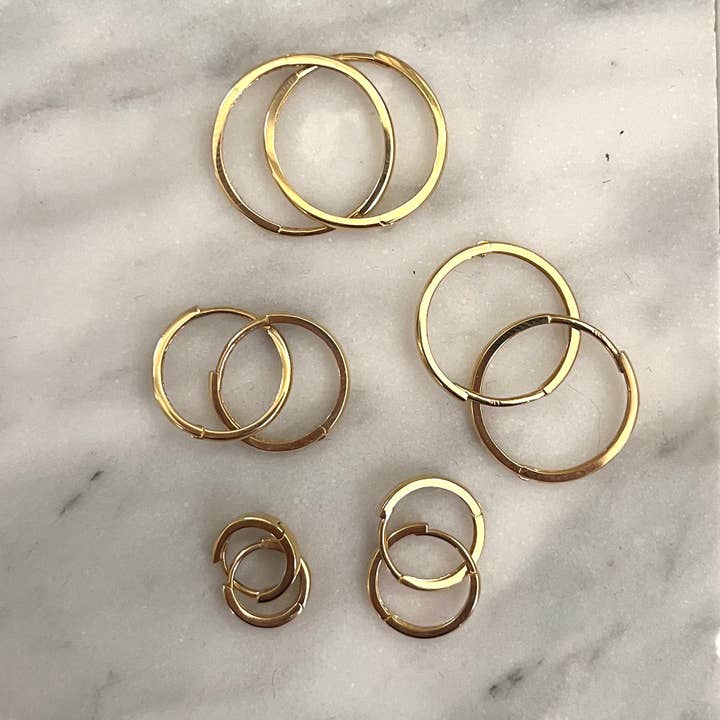 Solid 14k Gold Huggies for wholesale by TASI Designs