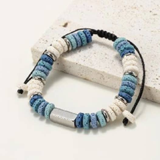 Flat bead bracelets in natural lava stone tinted with shades of blue and white for wholesale by INNOBIZ