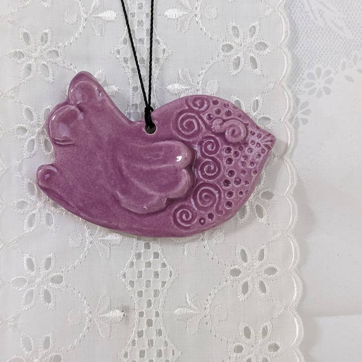 Handmade ceramic sweet bird ornament in lavender and white for wholesale by CurlyFernCeramics
