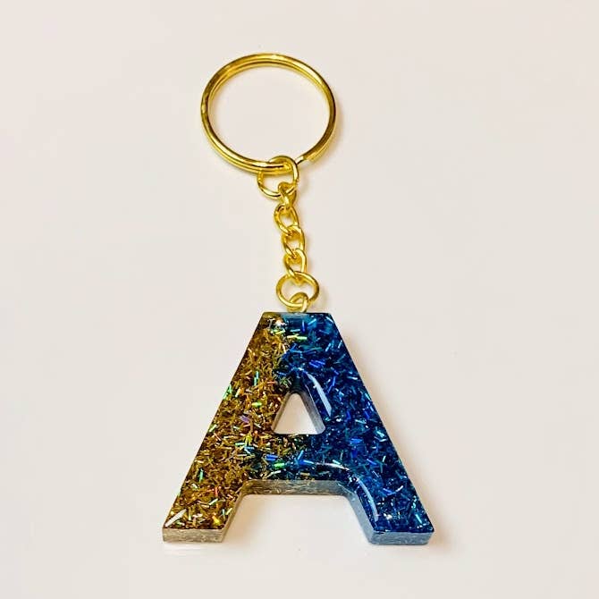 Sparkling Gold/Blue Letter Keychain for wholesale by Shop Drip Express