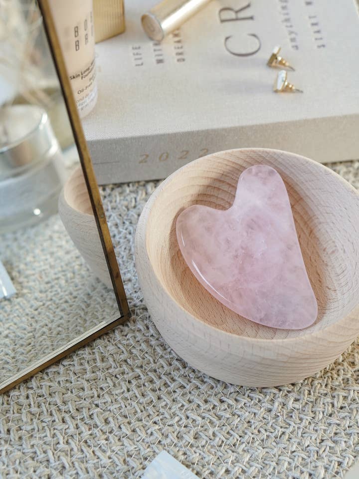 Rose Quartz Crystal Gua Sha with Black Skull Pouch for wholesale by Xander Kostroma