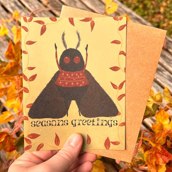 Carte de vœux de Noël Mothman avec pull moche pour la vente par Glitter and Toadstools