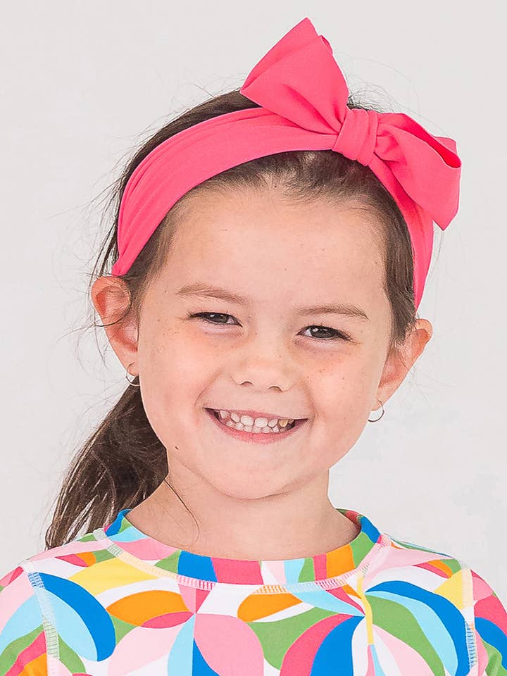 Girls Hot Pink Swim + Active Bow Headband
for wholesale by RuffleButts + RuggedButts