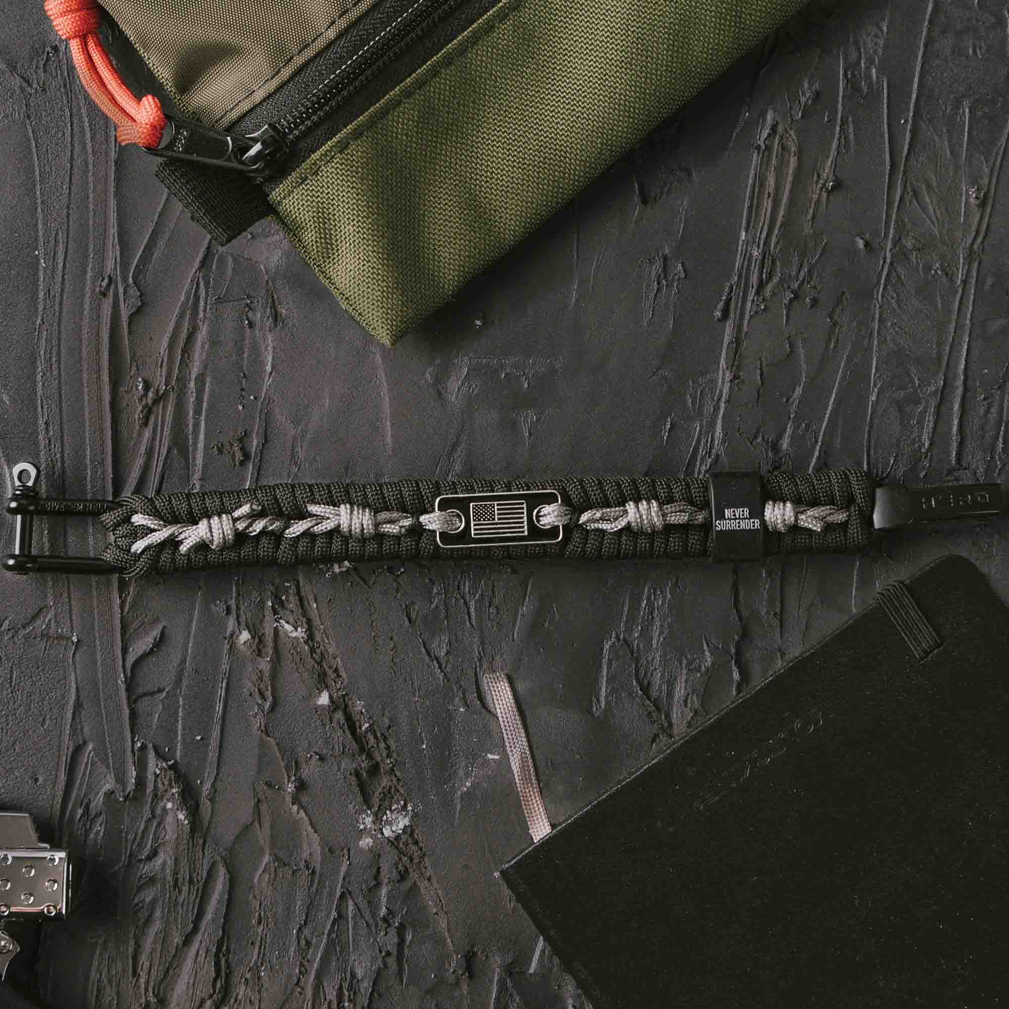 The Hero Company - Wholesale Woven/Braided Bracelet - The Hero Company- Never Surrender Barbed Wire Paracord Bracelet: Helps Pair Veterans With A Service Dog Or Shelter Dog- Faire10