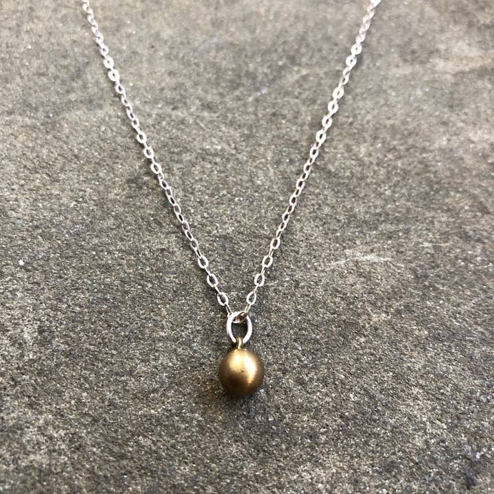 Tiny Vintage Brass Sphere for wholesale by Kate Stephen Jewelry
