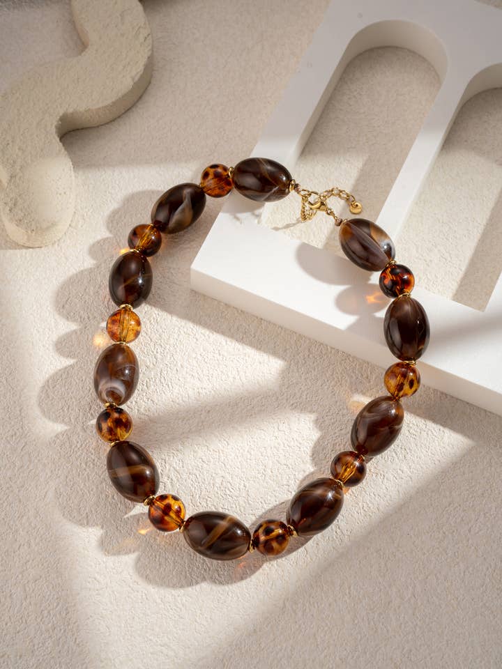Leopard and chocolate resin pearl necklace with chic stainless steel for wholesale by COSMOS