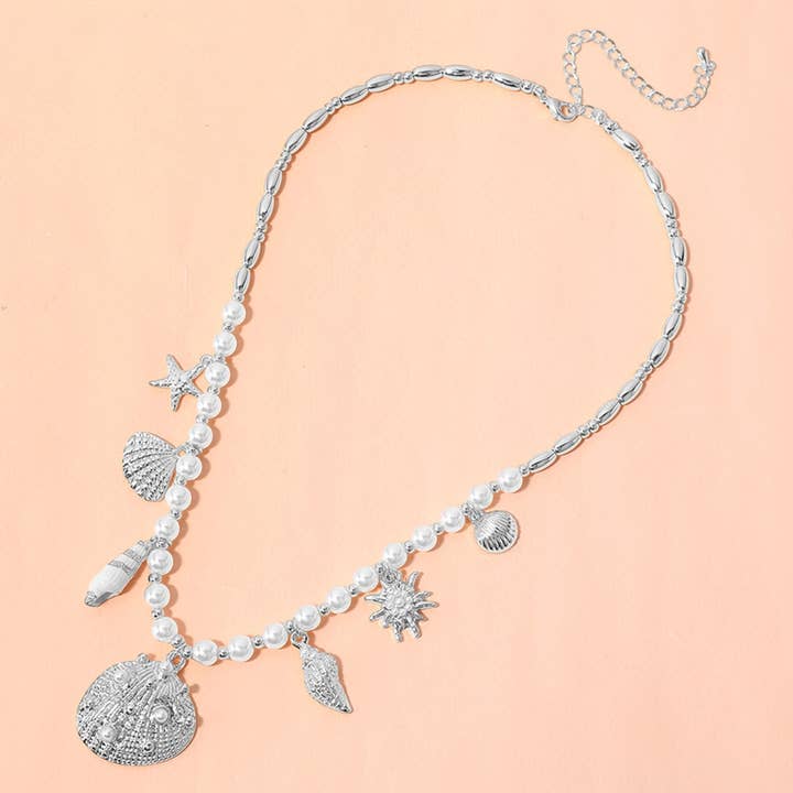 Sensibling Corp. - Wholesale Pendant/Charm Necklace - Sea Shell Puka Shell Starfish Charm Station Pearl Necklace