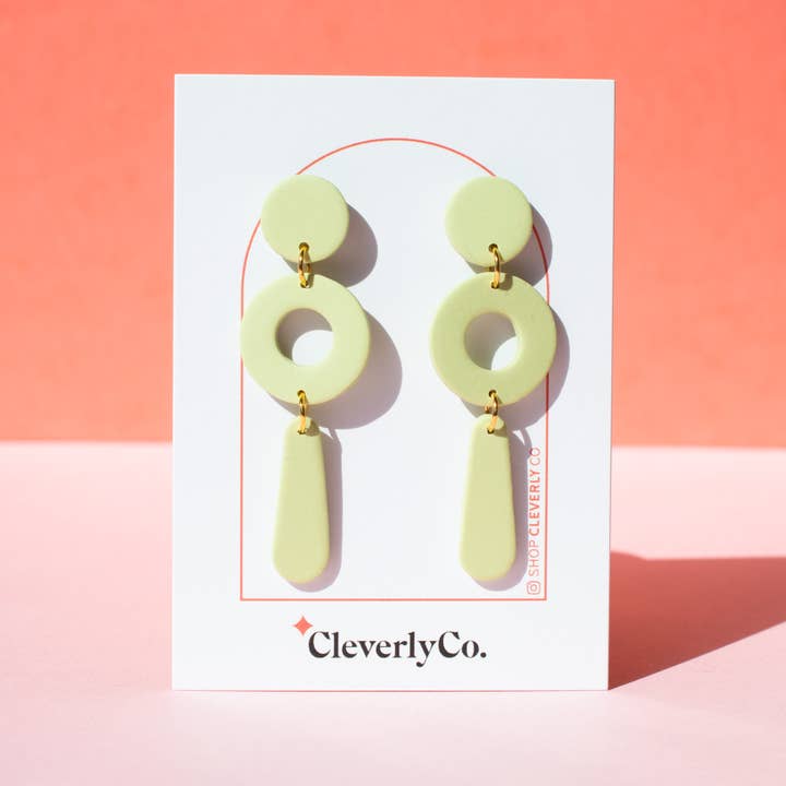 The "Packs a Punctuation" Earrings in Pistachio for wholesale by CleverlyCo.
