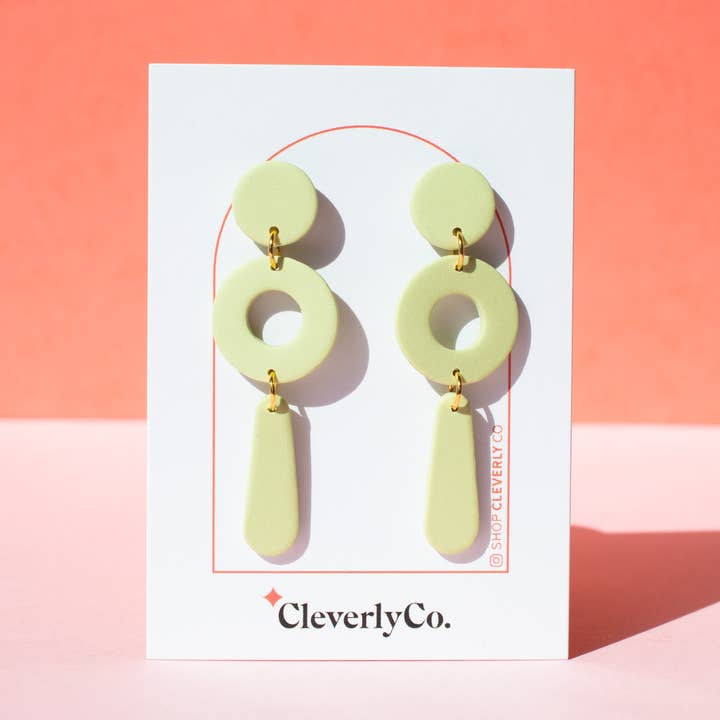 The "Packs a Punctuation" Earrings in Pistachio for wholesale by CleverlyCo.