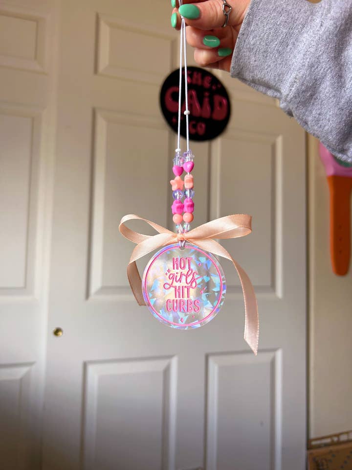 Hot girls hit curbs-car charm for wholesale by The Caid Co