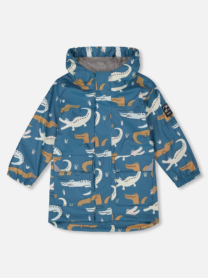 Blauer Regenmantel mit Krokodilen, die bei Kontakt mit Wasser die Farbe ändern für den Großhandel von Deux par Deux