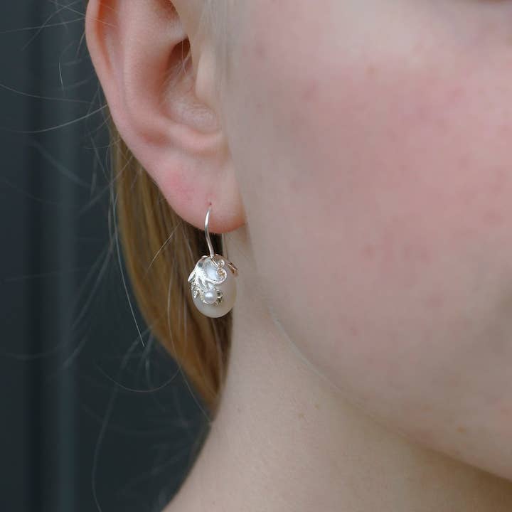 Pearl drop earrings with branch for wholesale by Hester Zagt Sieraden