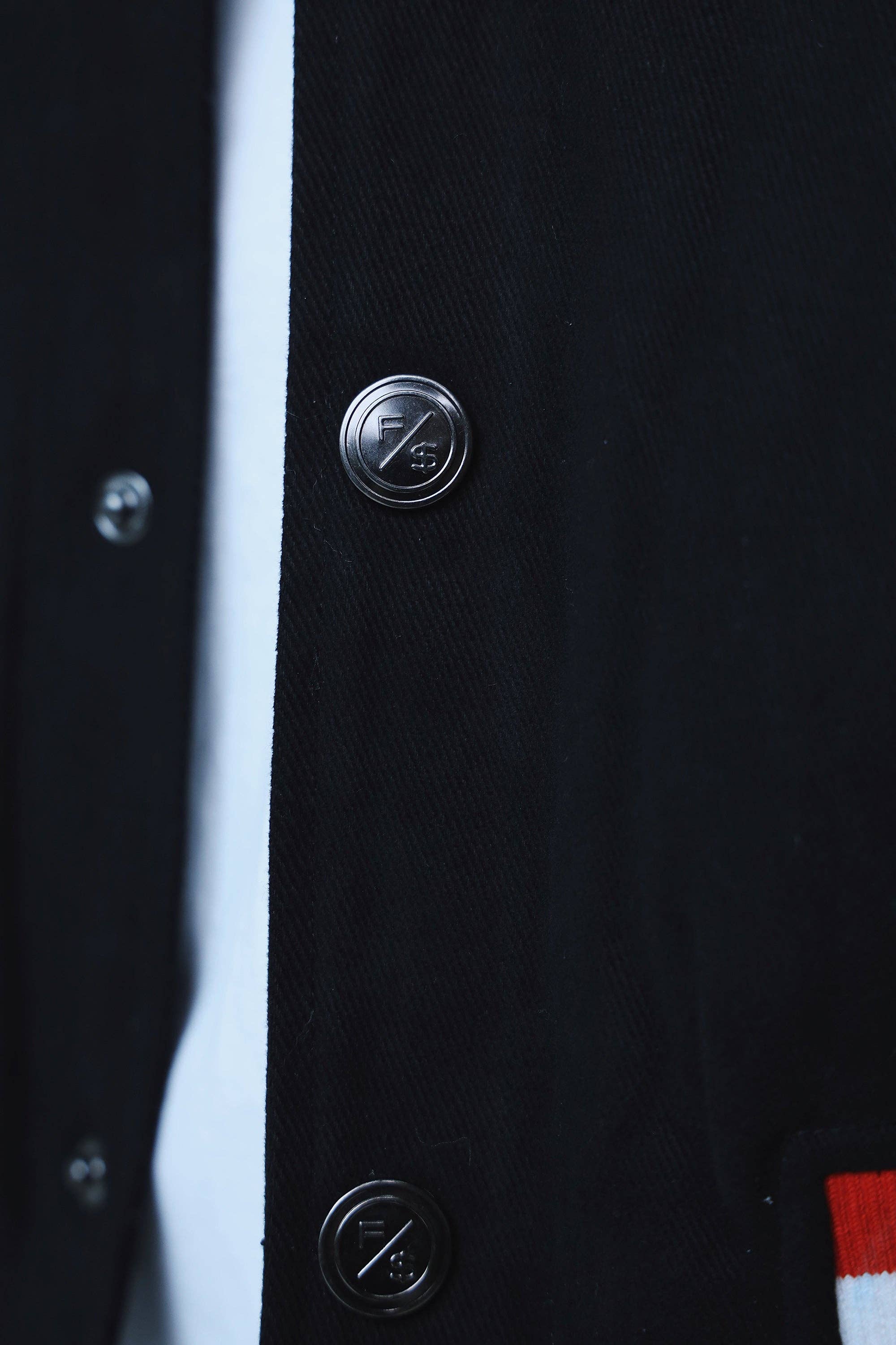 Denim Manifest Varsity Jacket (Black) for wholesale on Faire20