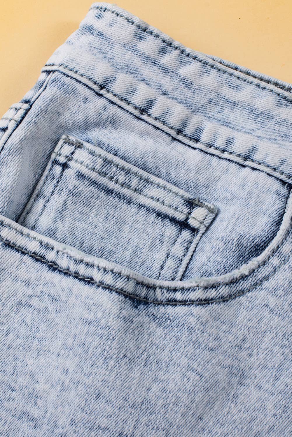 Light Blue Acid Wash Crossed Raw Edge Denim Shorts for wholesale on Faire5