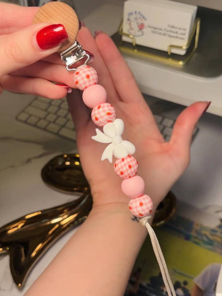 Strawberry Bow Gingham Paci Teething Clip for wholesale by Clip and Coast