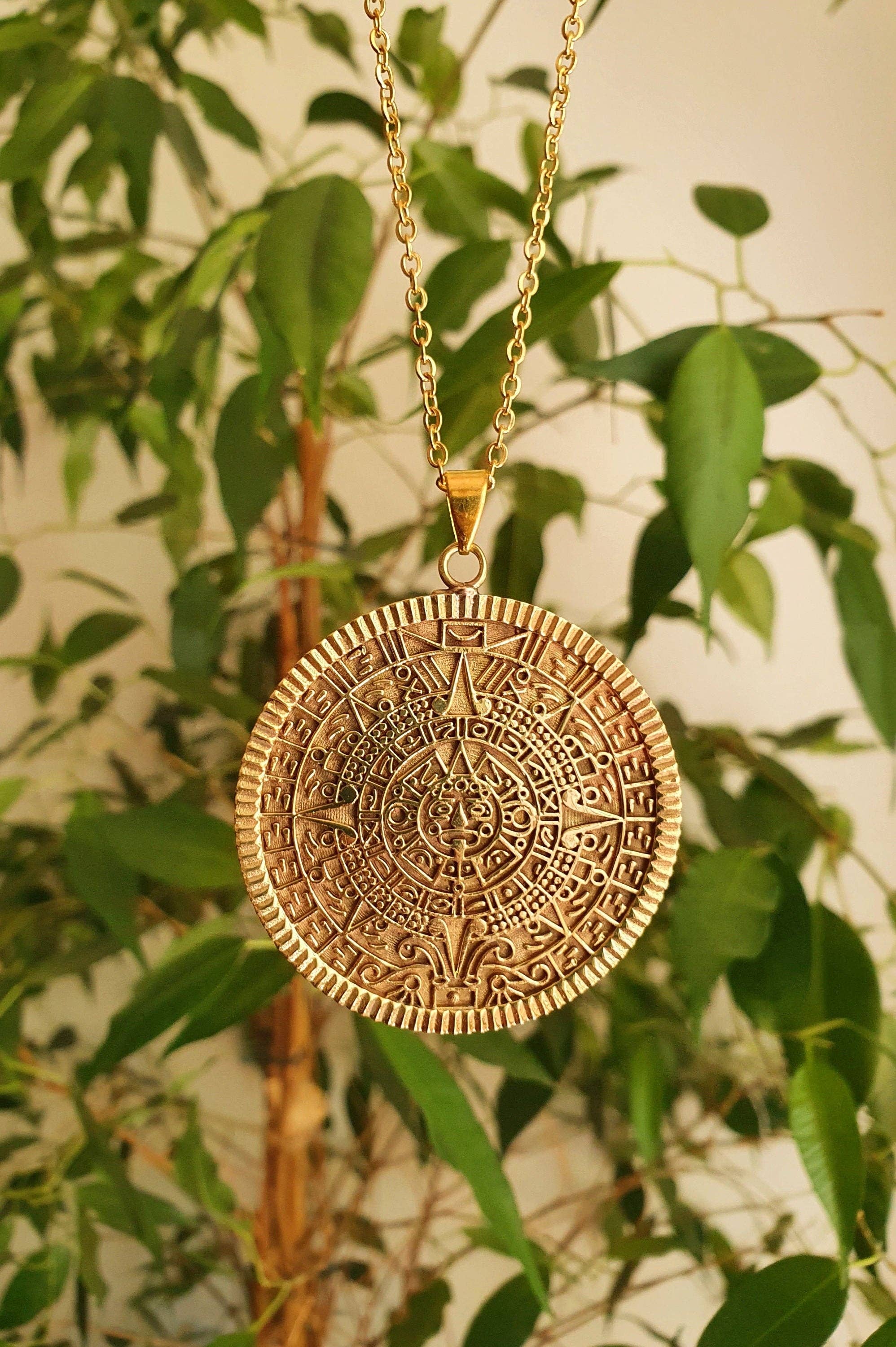 Kaali Boutique – wholesale Pendant/charm necklace – Gold Sacred Mayan Calendar Necklace / Hypoallergenic / Brass / Boho / Aztec / Inca / Ethnic / Hypoallergenic / Third Eye / Illuminati6