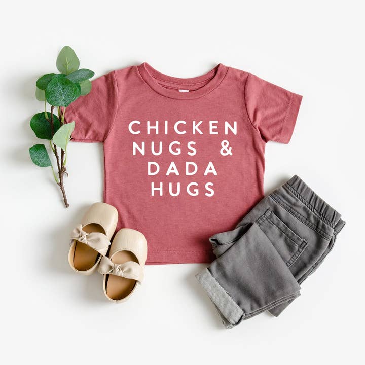 Chicken Nugs & Mama/Dada Hugs Toddler Tee and other Purchase Wholesale chicka chicka. Free Returns & Net 60 Terms on Faire trending on Faire.