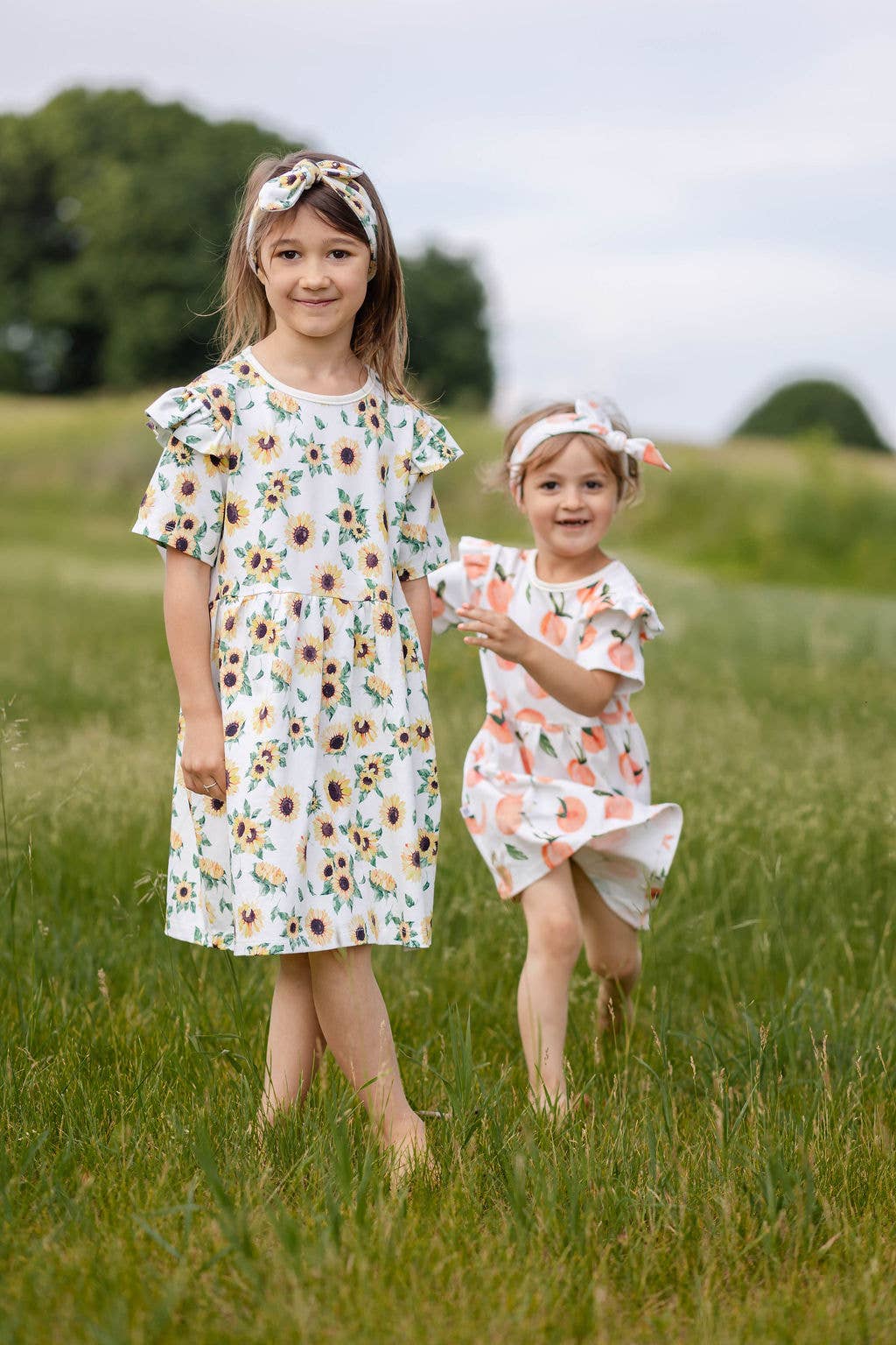 TeoBee - Wholesale Jurk - Kinderen - Meisjesjurk met korte mouwen in perzikoranje, draaiend, 3m - 8j4
