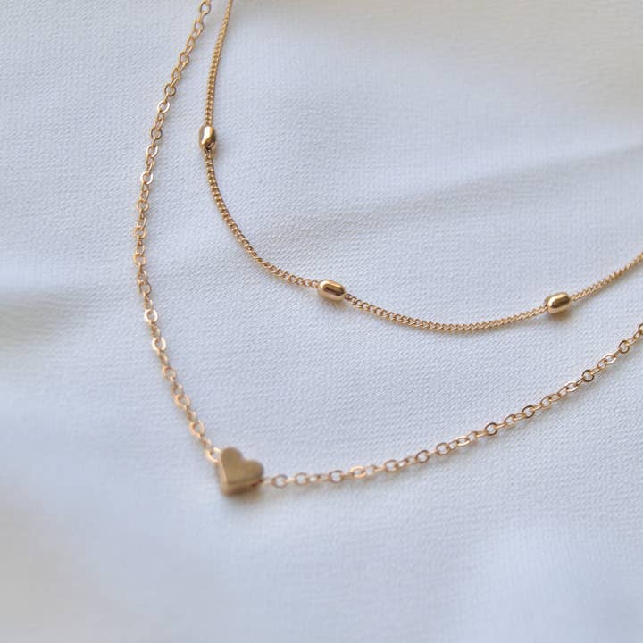 Delicate Layered Gold Necklace with Heart & Bead Detail for wholesale by EAST INDIA IMPORTS