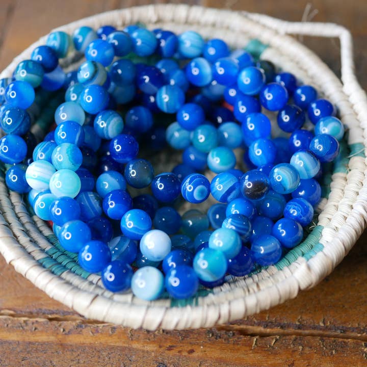 Ædelsten strækarmbånd blå båndagatforstærket for engroshandel hos Superior Stones & Gifts INTL LLP