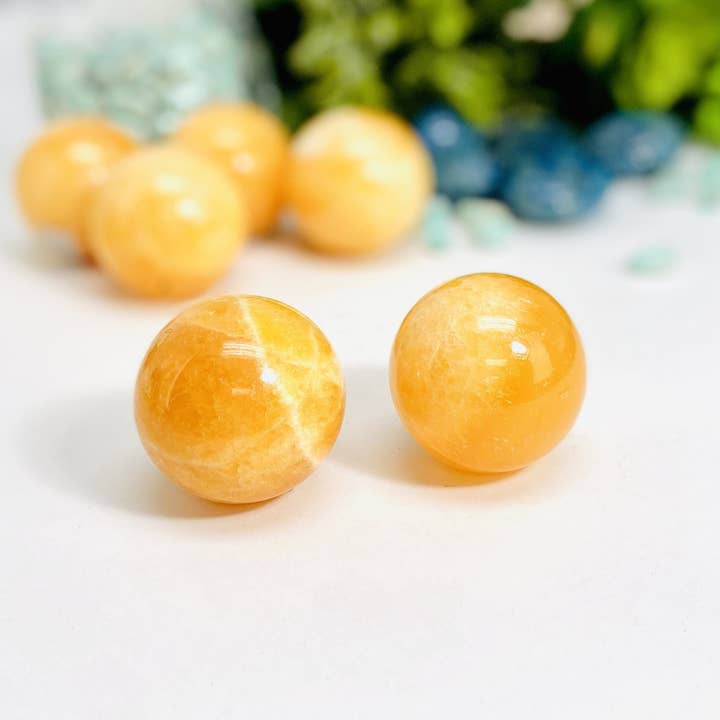 Orange Calcite Crystal Spheres for wholesale by Rock Paradise