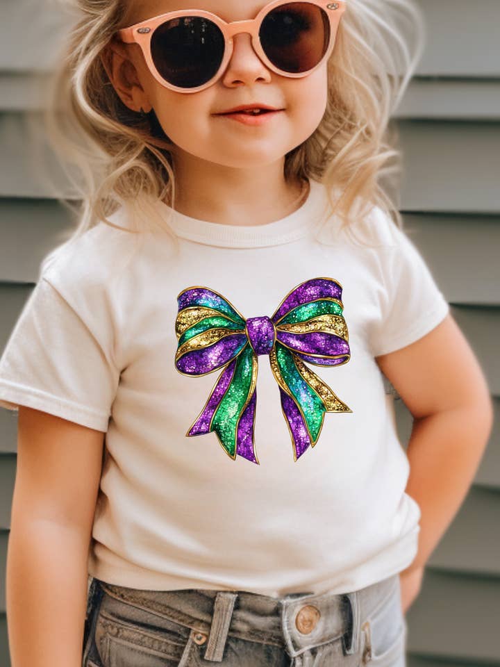 Faux Sparkly Mardi Gras Bow Toddler Graphic Tee for wholesale by Uncommon Label