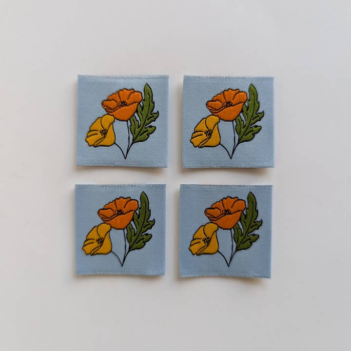 August Poppies | Woven Luxe Labels and other Purchase Wholesale remembrance poppies. Free Returns & Net 60 Terms on Faire trending on Faire.