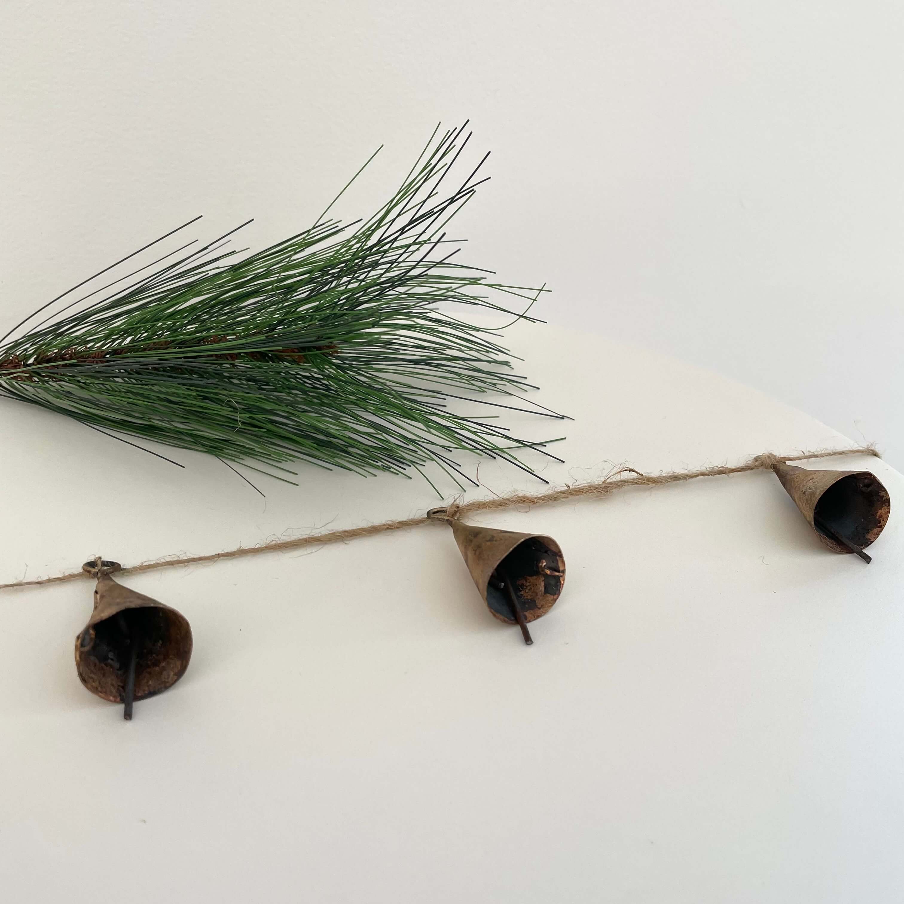 fort & field – wholesale Bunting/garland – Rustic tin cone shaped brass bell jute holiday garland4