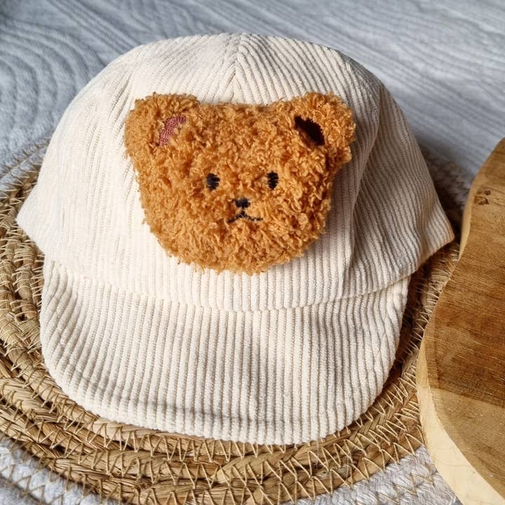 Beige corduroy baby/kids cap with teddy bear for wholesale by Rammelaartje