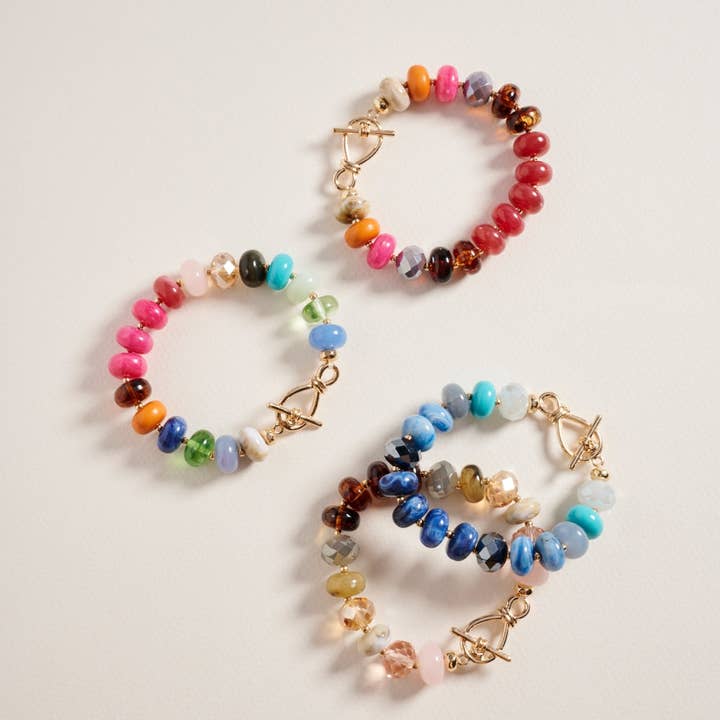 Bracciale elastico ovale con perline in resina sfumata marmorizzata per la vendita all'ingrosso da parte di Verita Lane