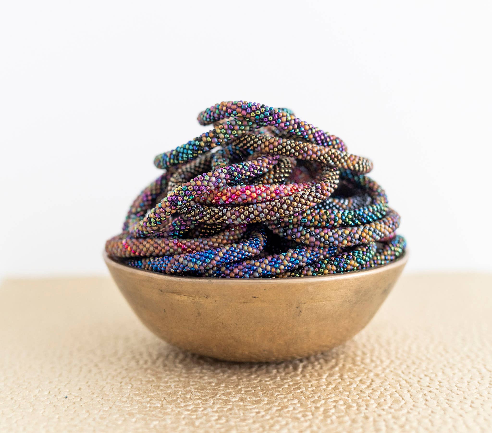 Aid Through Trade – wholesale Beaded bracelet – Roll-On® Bracelets - Ammolite Set of 121