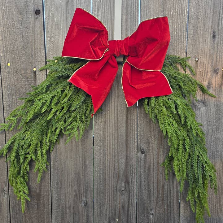 An Array of Wreaths, LLC – wholesale Christmas decoration – Norfolk Pine Greenery Swag with Red Bow2