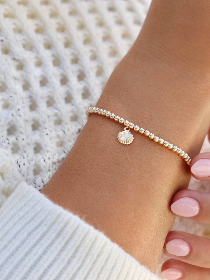 Non-tarnish Gold Filled Delicate Bracelet, Tiny Shell Charm for wholesale by Kaylie Dawn Jewelry