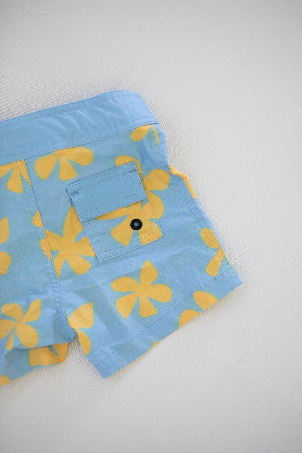Kid’s Townshort Boardshorts in Light Blue Plumeria for wholesale on Faire9