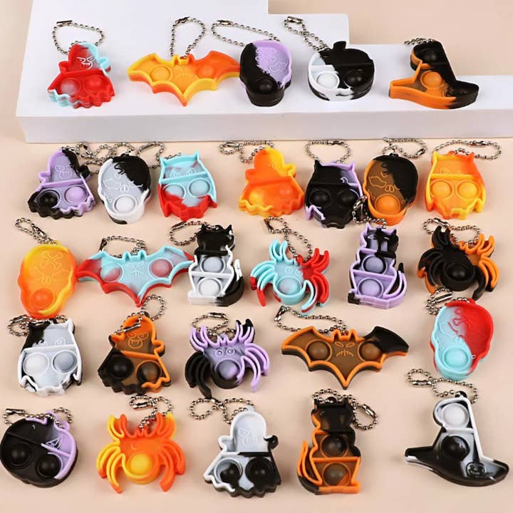 Halloween Mini Pop Keychain Toys – Pumpkin Spice, Bat, Skull and other Purchase wholesale halloween keychains. Free returns & net 60 terms on Faire trending on Faire.