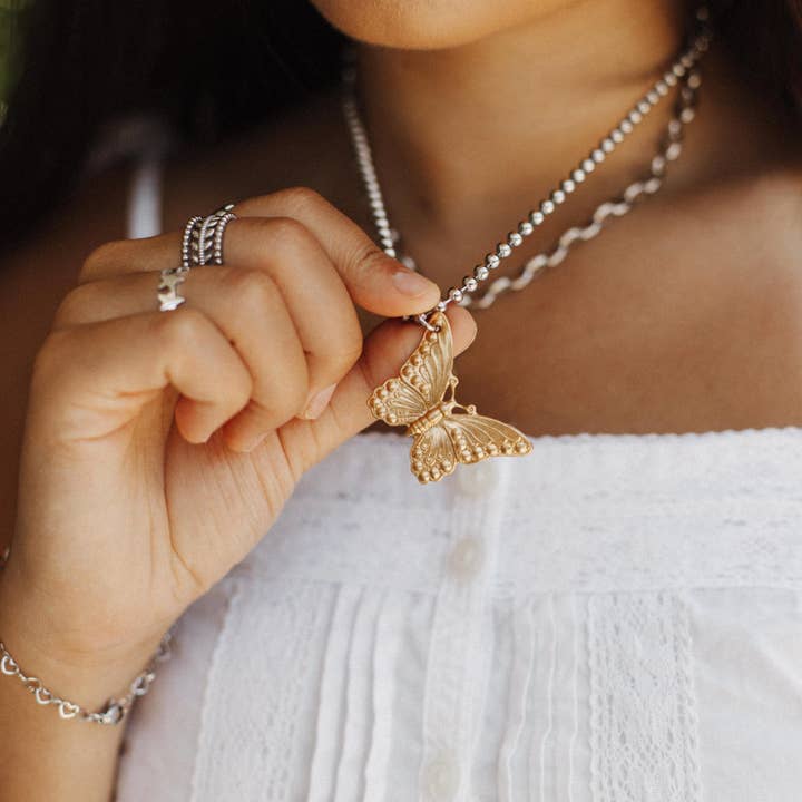 Butterfly Brass Charm Necklace for wholesale by Sosobella Designs